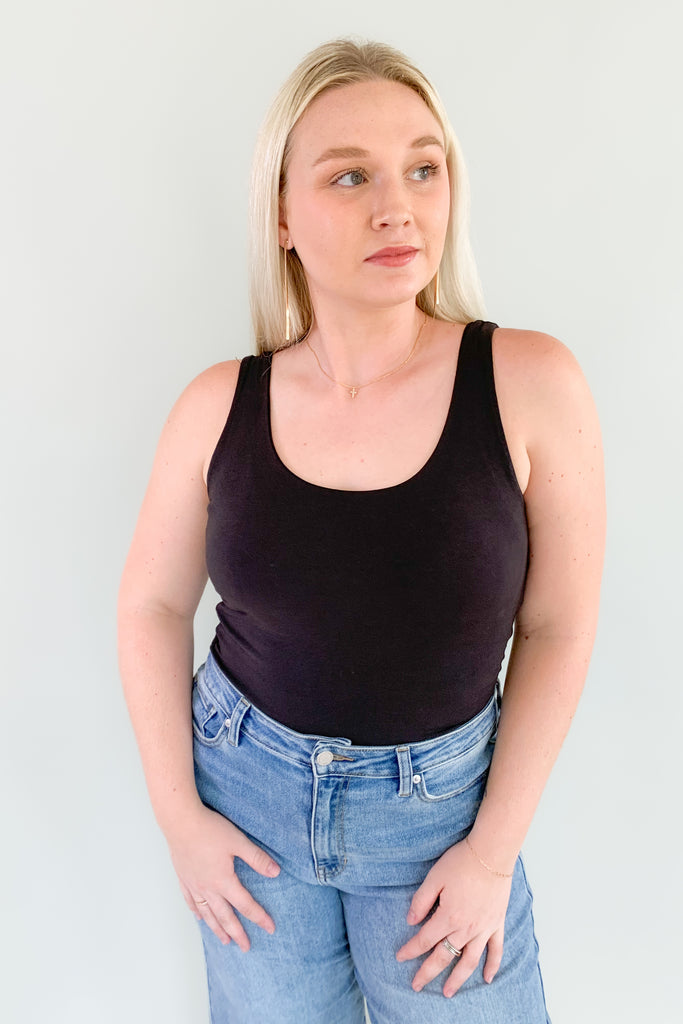 The Dolo Double Lined Tank is super soft and elevated with a banded hem for security. You can tuck it into your bottoms with confidence that it's there to stay! The double lined material is very elevated too. 