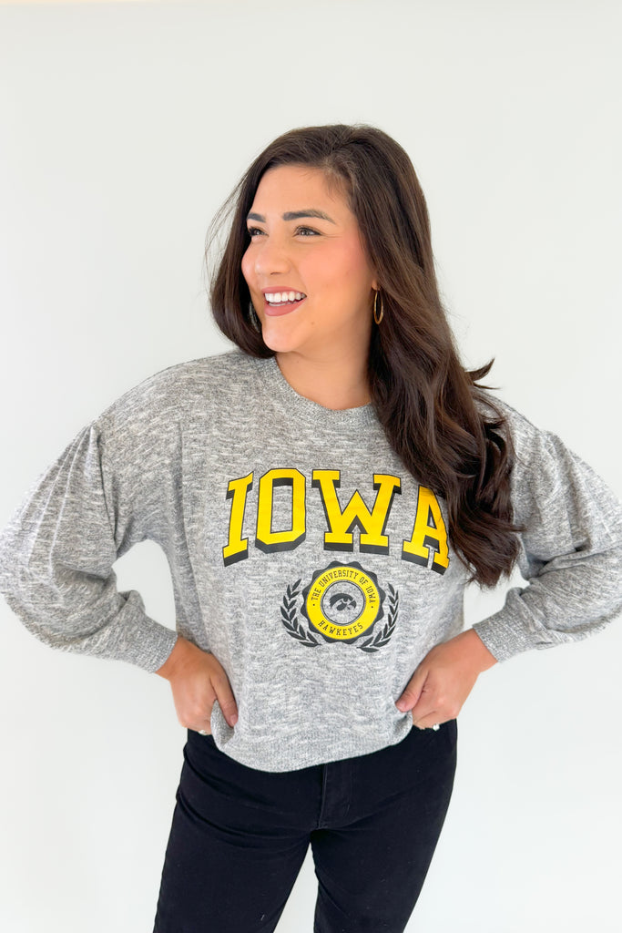 Stay cozy and game day ready with this Iowa Soft Heather pullover! Featuring puff sleeves, a heathered grey wash, and a subtle logo on the chest, this pullover is perfect for on-campus strolls or at-home lounging. Hawkeye fans, you will love the fabric because it's incredibly soft and lightweight, making it a comfortable option. We love the puff sleeve details too, giving this style a unique feminine look! 