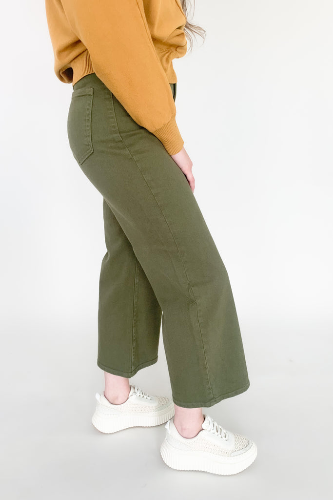 Trousers have taken over! This trending wide leg trouser from Just Black Denim is high-waisting and made with a thick fabric that molds to your body. With a relaxed fit through the knee and a wide open leg, you will be loving the comfort and look of this style! 